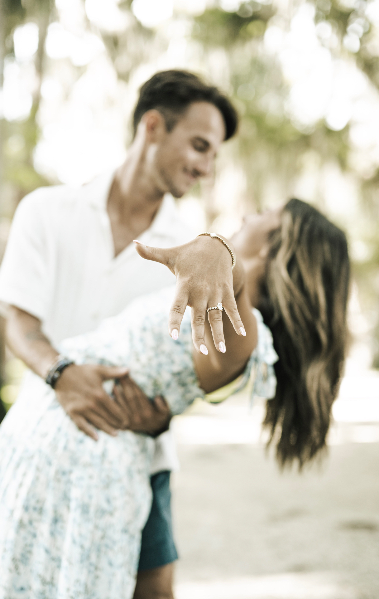 Newly engaged couple showing off the ring